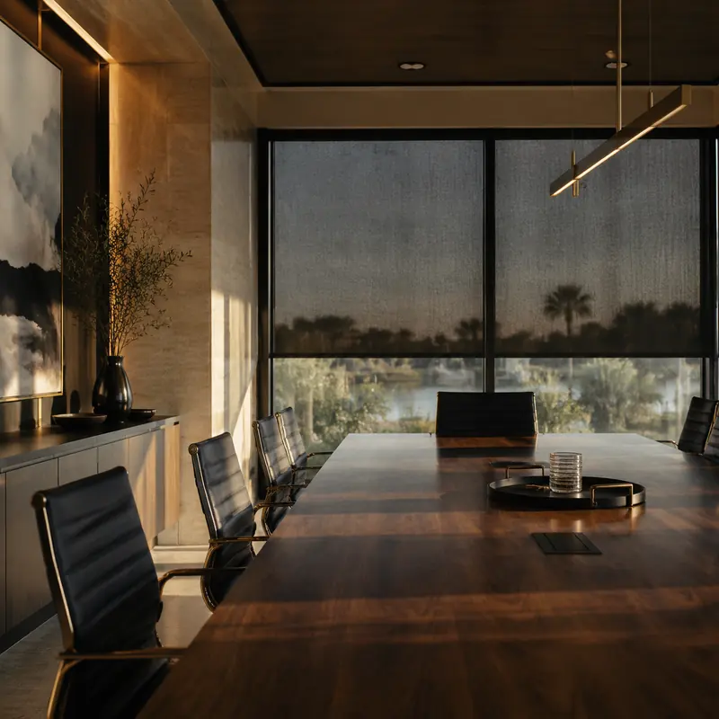 Conference room with charcoal solar screen shades controlling glare